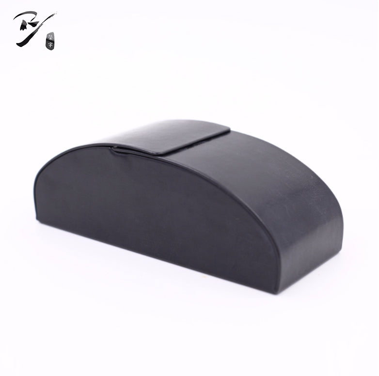 Arched handmade eyewear case with a flat base, rounded ends, and flap-over-front opening